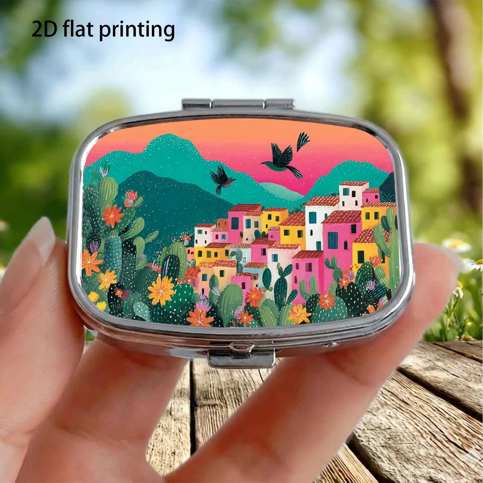 Single pack, flat macaron-colored hillside cottage with flying birds, featuring a fresh South American landscape illustration pattern, square compartmentalized pill box, portable medicine storage box