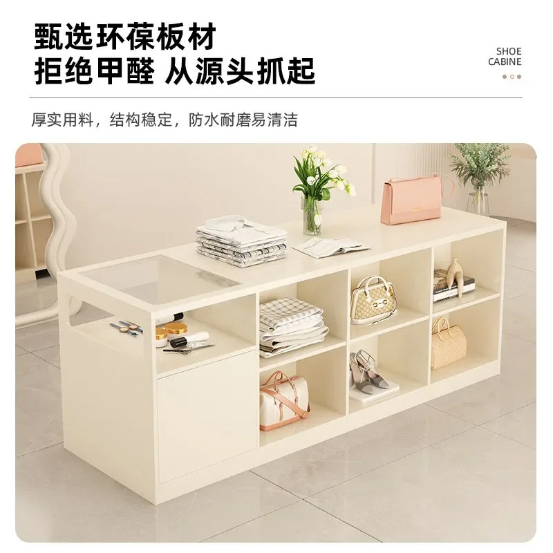 Clothing stores, women's clothing stores, island tables, flowing tables, store displays, tables, storage cabinets, simple cash r