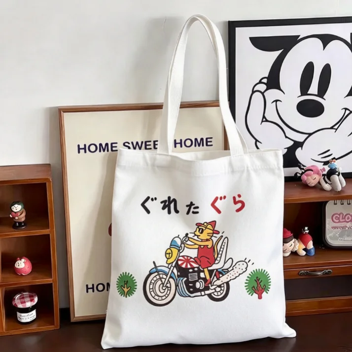 2026 Black Canvas Tote Bag Cartoon Cat Riding Motorcycle Print Casual Shoulder Bag Reusable Shopping Handbag