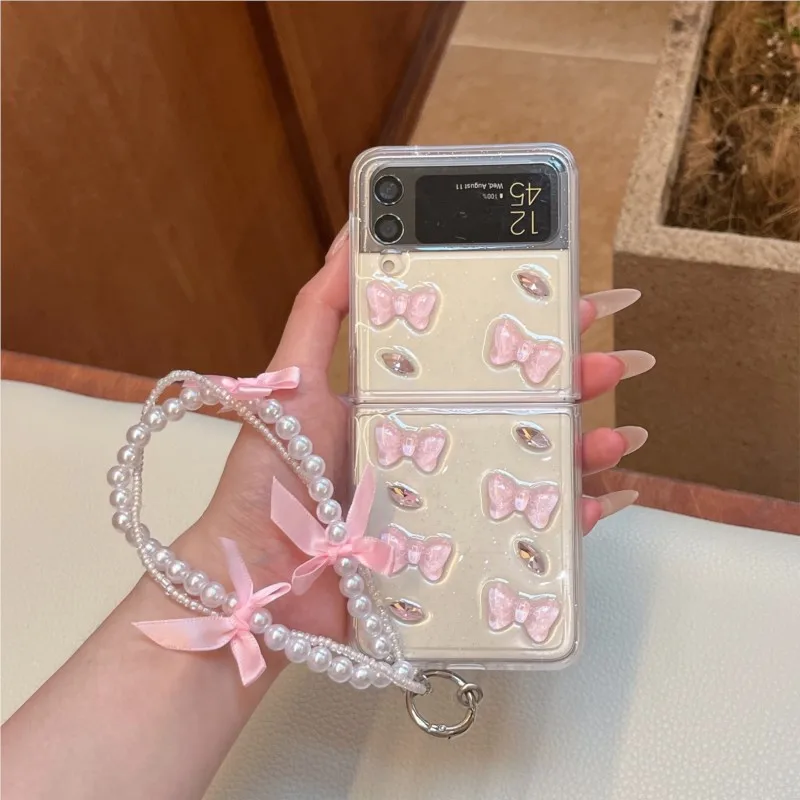 3D Pink Bow Pearl Rhinestone Phone Case With Wrist Strap For Samsung Galaxy Z Flip4 Flip5 Flip6 Flip7FE Flip7 Flip8 Cute Cover