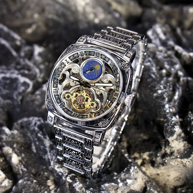 

A Men's Silver Steel Band Retro Business Style Moon Phase Carved Automatic Mechanical Watch
