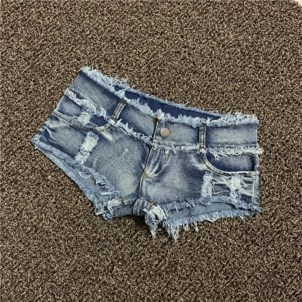 

Casual mid-rise denim shorts with distressed hem and ripped details