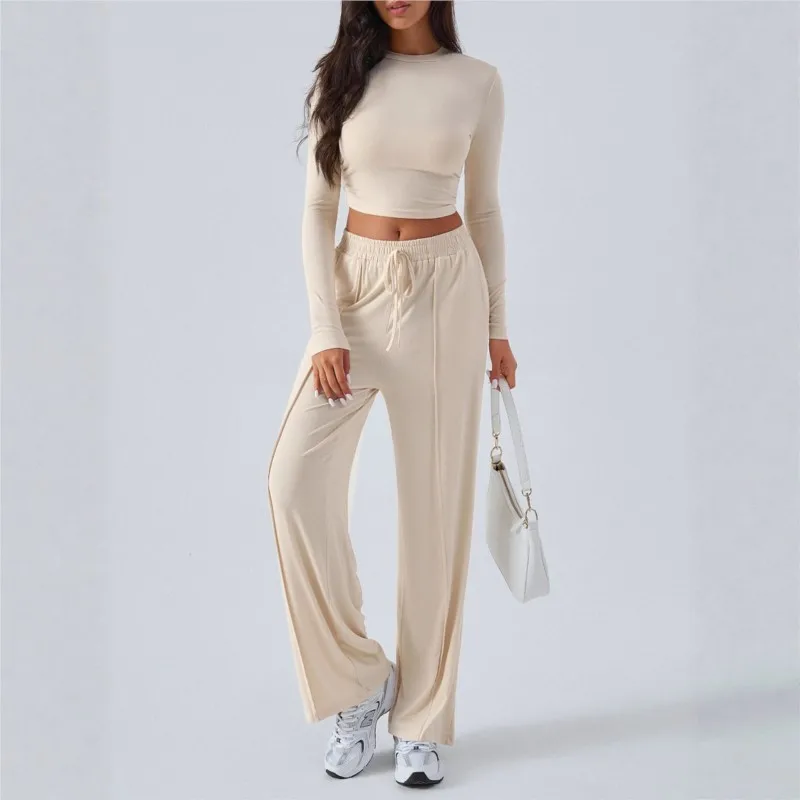 

2025 горячий стиль, модный однотонный женский костюм, повседневный комплект с круглым вырезом и длинными рукавами, тонкий топ с пупком, широкие брюки, комплект из двух предметов