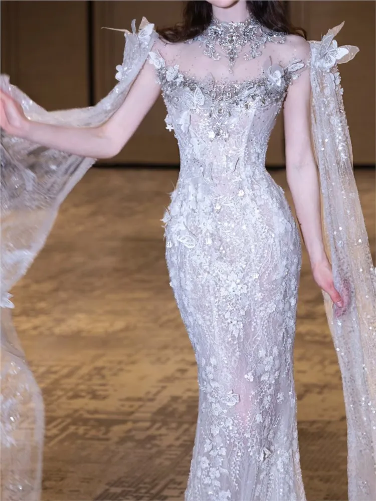 

The white host walks runway toasts with beaded and girl wears a strapless dress over her shoulders