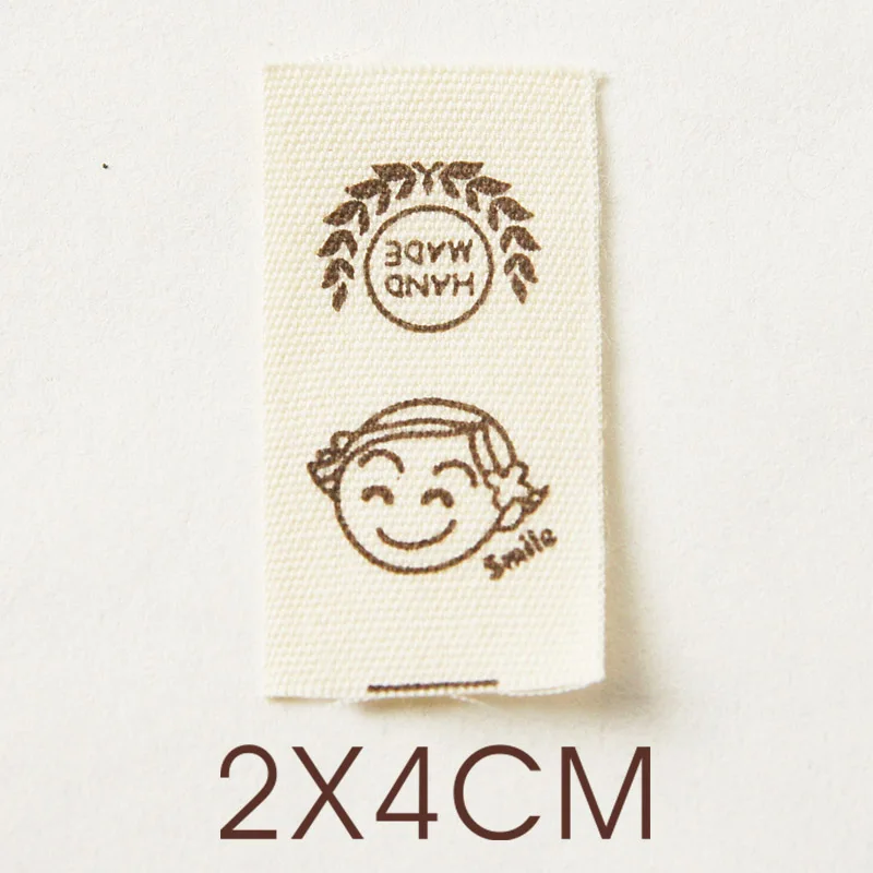 Hand-folded spot shipping mark head tulip bouquet smiling face cloth label accessories sewing DIY side label.