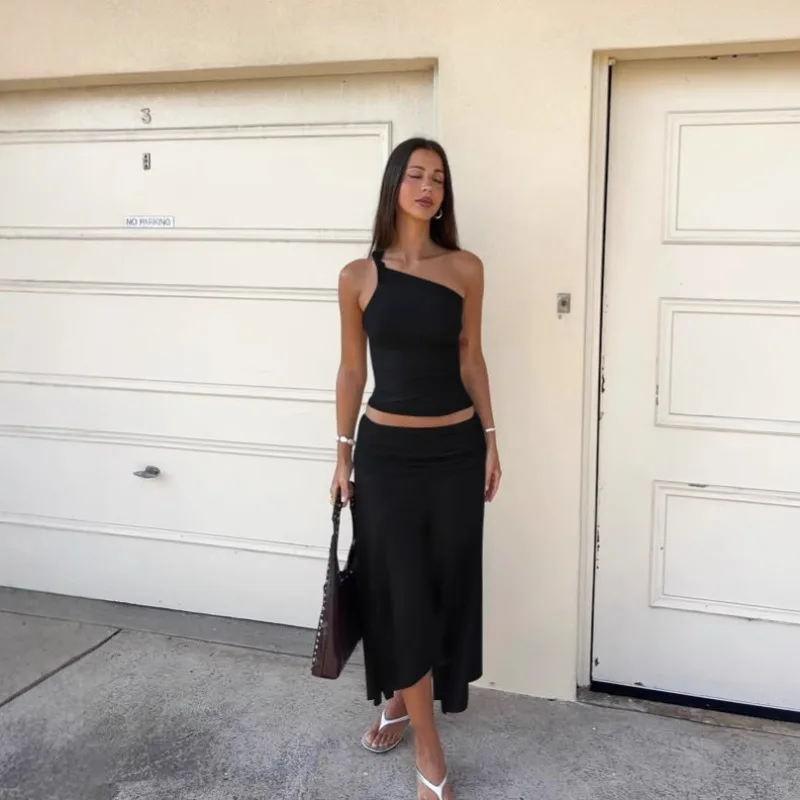 Set da due pezzi con gonna a pieghe a vita alta senza maniche con spalla inclinata in tinta unita da donna in stile europeo e americano