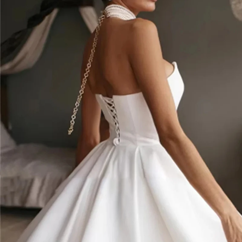 Biała suknia ślubna bez ramiączek dla kobiety, satynowa suknia wieczorowa w kształcie litery A, bez rękawów, elegancka sukienka na przyjęcie o długości do herbaty, szyta na miarę.
