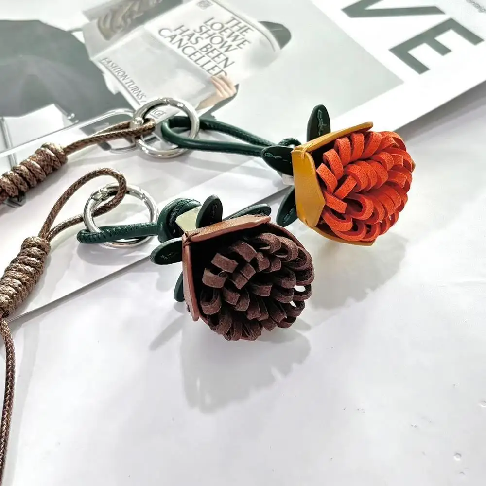 اليدوية زهرة شرابة الكرة حقيبة سحر الجلود زهرة حبل مضفر أكياس قلادة المفاتيح سيارة قلادة الديكور حقيبة الملحقات