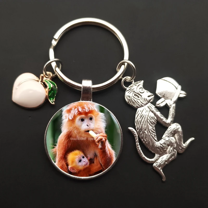 Monkey charm keychain monkey painted glass cabochon car bag ornaments peach keychain men and women souvenirs