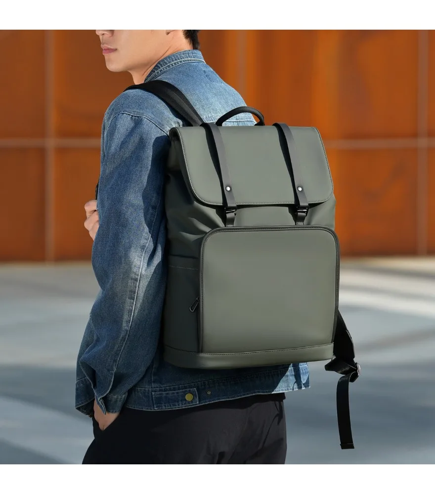 Dark green roll top backpack with black strap details matte water resistant surface single large front pocket suitable