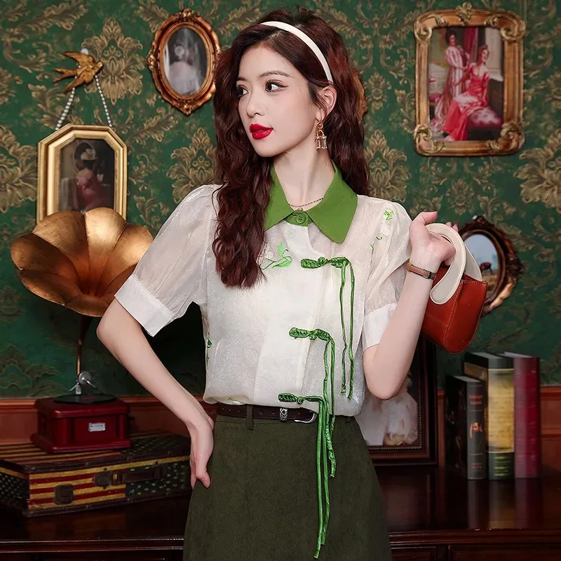 

Women's White And Green Color Block Peter Pan Collar Short Sleeve Frog Button Sheer Blouse