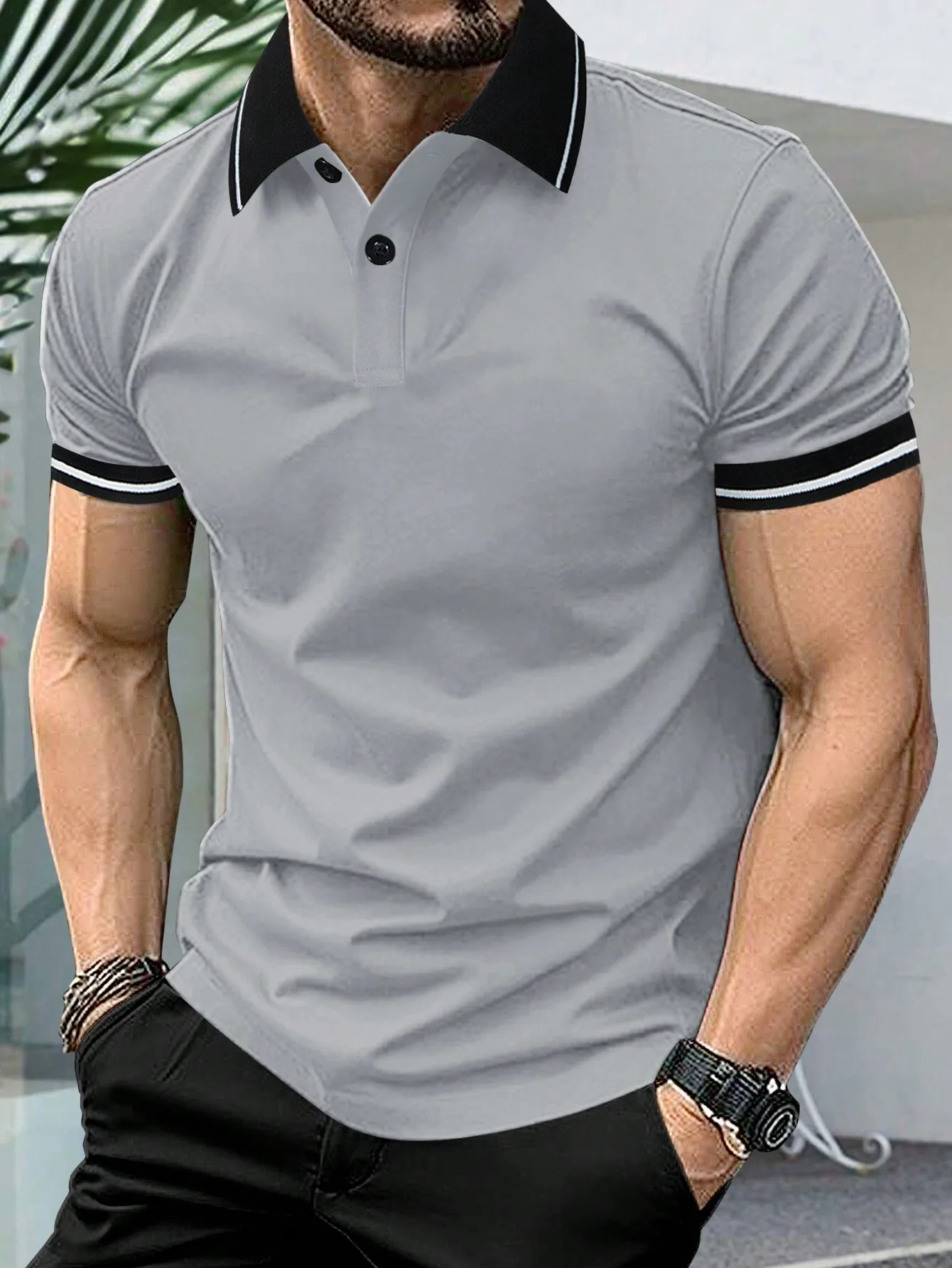 

Men's Gray Short Sleeve Polo Shirt with Black and White Trim Collar and Cuffs