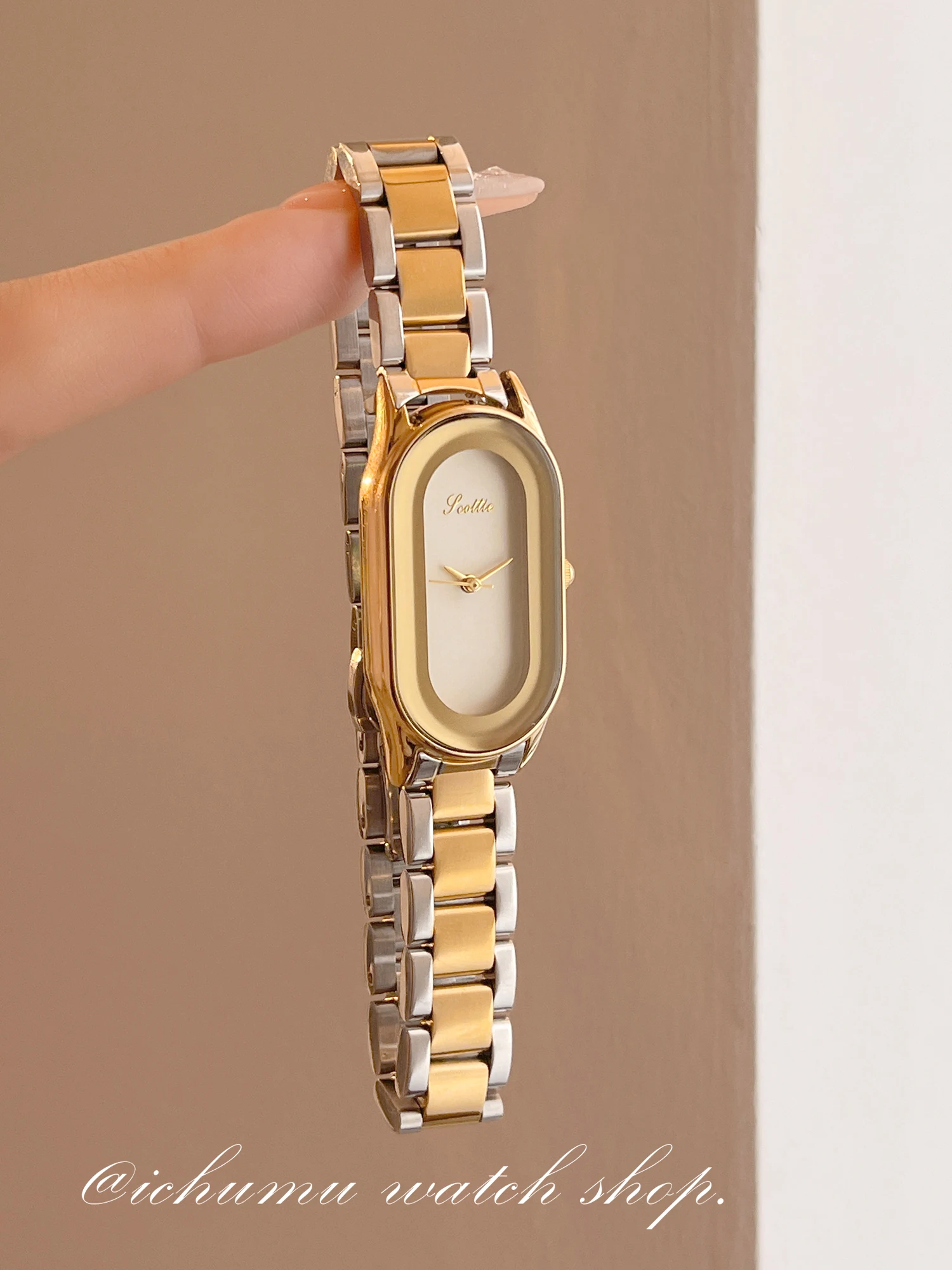 

Women's oval-shaped watch with a stainless steel strap, exuding sophistication and versatile style; a women's accessory.
