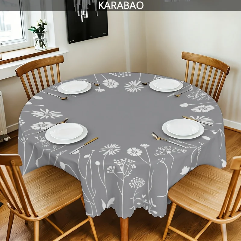 A round tablecloth with a grey background and white floral pattern, featuring an elegant and natural design.
