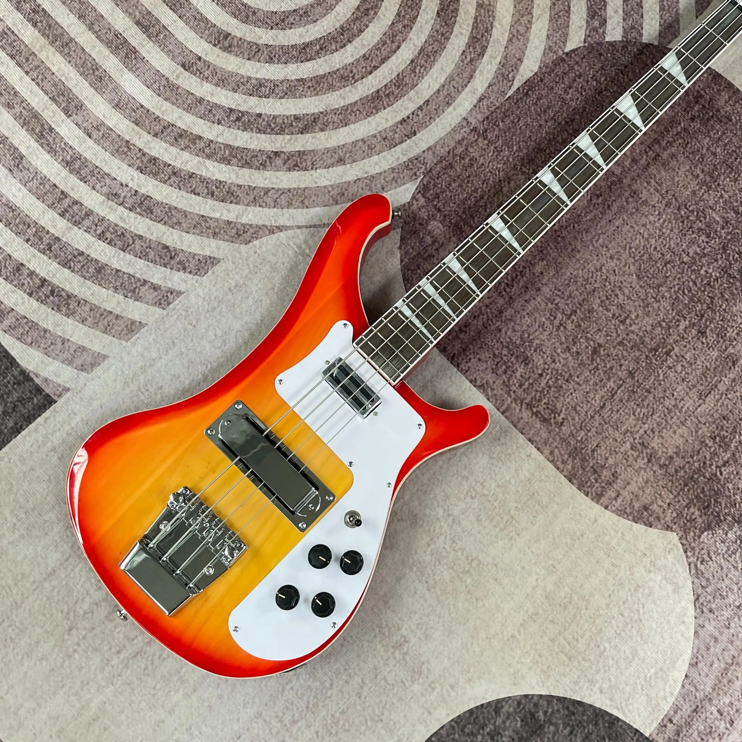 Sunburst 4 String Bass, Crescent Body, Dual Single Coils, Chrome Floating Bridge + Tailpiece, Trapezoid Inlays, Retro