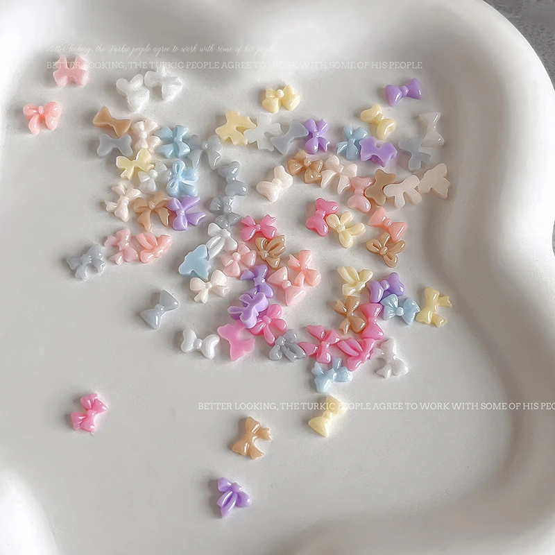 50pcs Candy สีโบว์เล็บอะไหล่ Charms MINI เรซิ่นริบบิ้นเล็บ Rhinestones DIY ฤดูร้อนอุปกรณ์ตกแต่งเล็บ