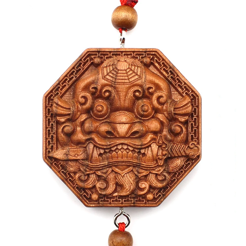 Peach wood, beast head, gossip mirror pendant, lion biting sword, feng shui wood carving, to solve the problem of toilet door to