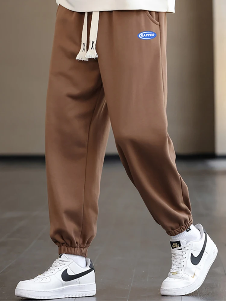 2023 New Men's Solid Color Simple Leisure Pants Padded Drawstring Feet Sports Casual Fashion Trend Versatile Nine-Minute Pants