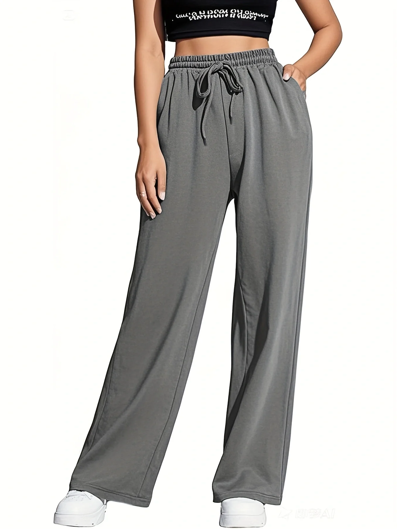 Relaxed straight-leg pants with wide cuffs, elastic waistband, and pockets