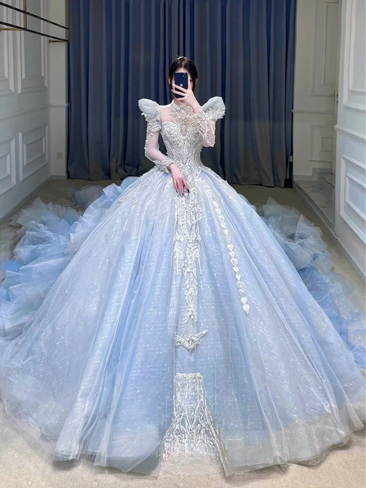 

A new long-sleeved dress with large tail and high-neck misty blue color