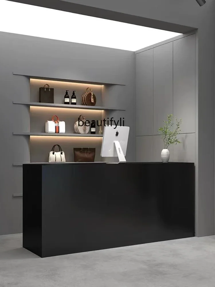 Clothing store checkout page store small counter black minimalist nail salon bar simple modern beauty salon front desk