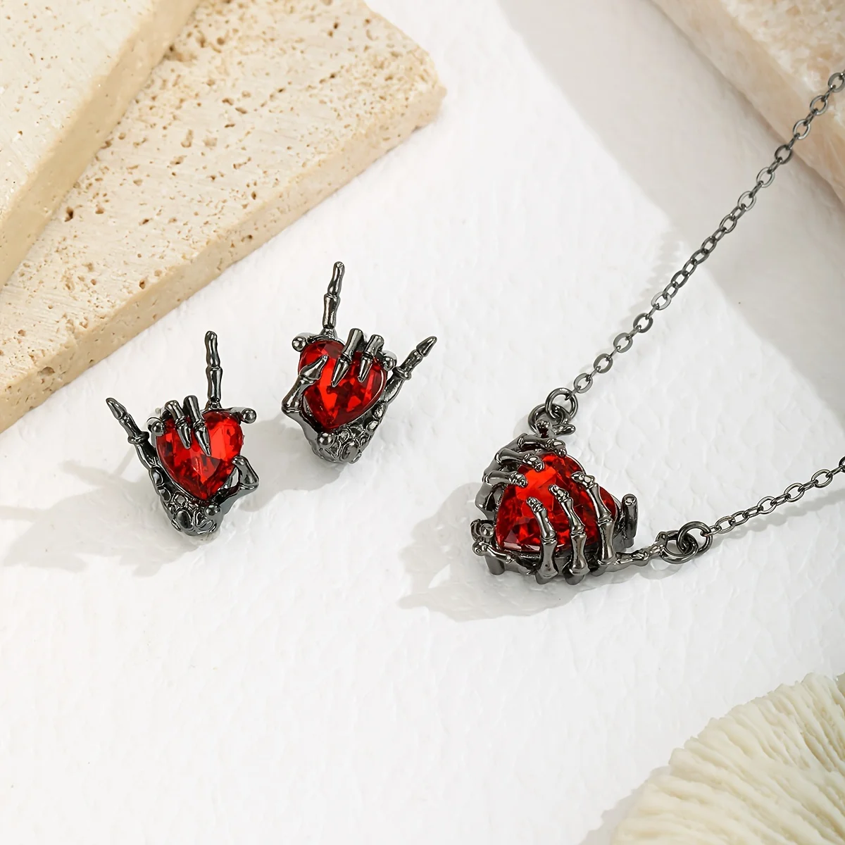 A Necklace Plus a Pair of Earrings, a Stylish And Creative Design Featuring a Hand Grasping a Heart, a Heart-Themed Necklace And Earring Set, Perfect for a Dark Halloween Gift.