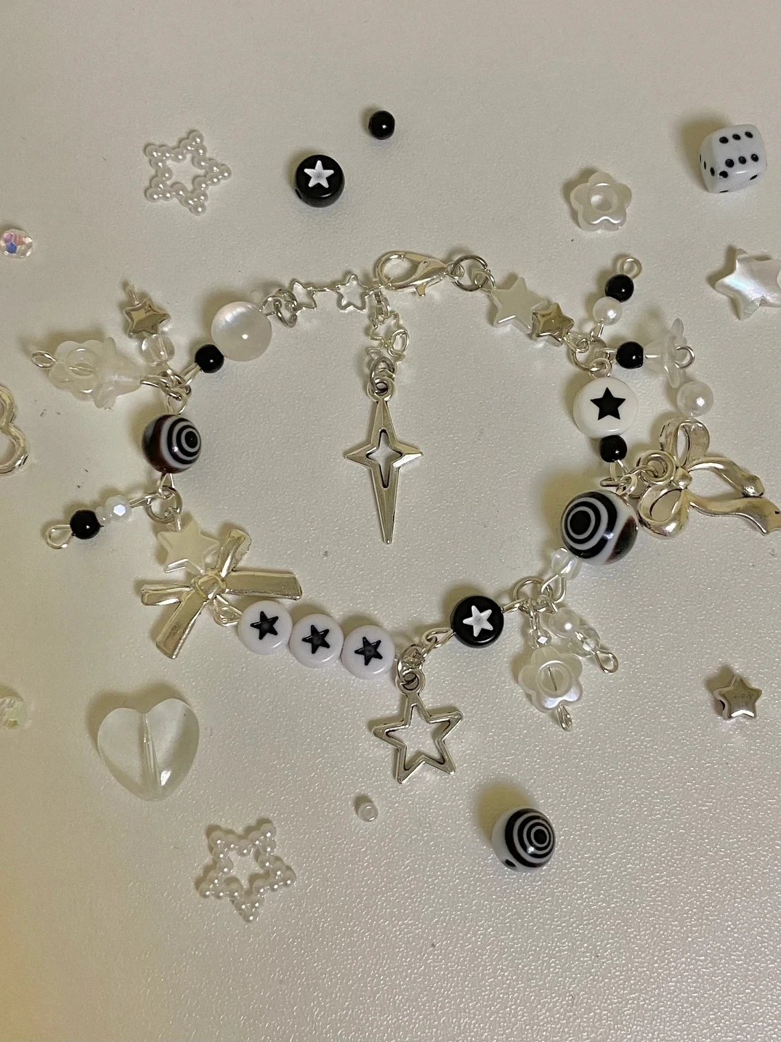 aesthetic cluttered beaded black and white star bracelet