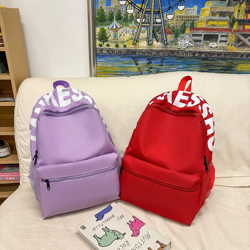 Lightweight Casual Backpack for Students Durable Nylon Daypack with Letter Print and Front Pocket for School Daily Use