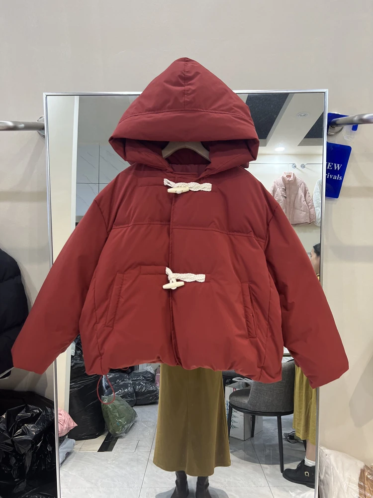 Nuovo piumino da donna con cappuccio 2023 inverno moda coreana fibbia in corno piumino d'anatra bianco manica lunga cappotto Casual caldo