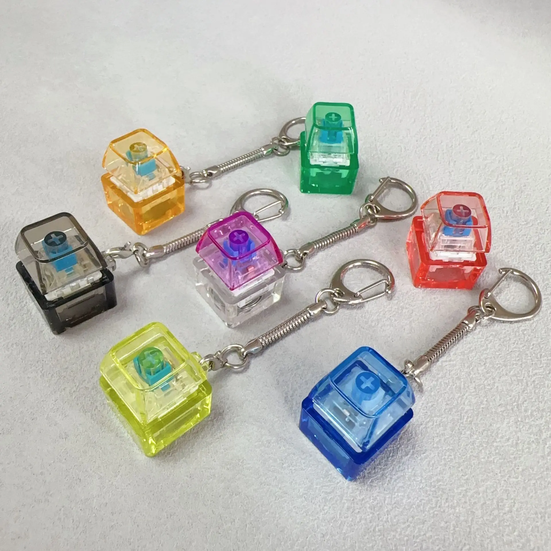 Llavero Antiestrés Luminoso de 1/9 Piezas - Botones Transparentes de 4 Teclas, Juguete Sensorial de Oficina para la Ansiedad