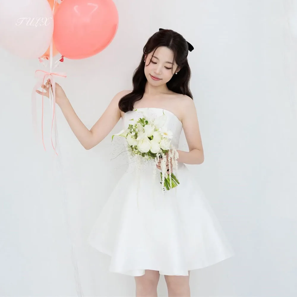 ชุดแต่งงานมินิแบบเรียบง่ายสีงาช้างผ้าซาตินสไตล์เกาหลีสำหรับถ่ายภาพ ชุดเจ้าสาวทรงเอแบบสั้นไร้สายรัดคอ  ชุดแต่งงานแบบคอร์เซ็ทสั่งตัดได้