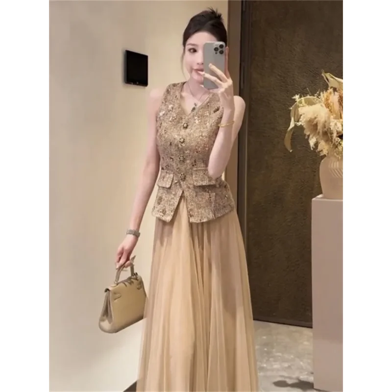 Set da due pezzi da donna francese nuova estate moda gilet sottile senza maniche con paillettes + gonna longuette a trapezio in rete piccolo abito profumato