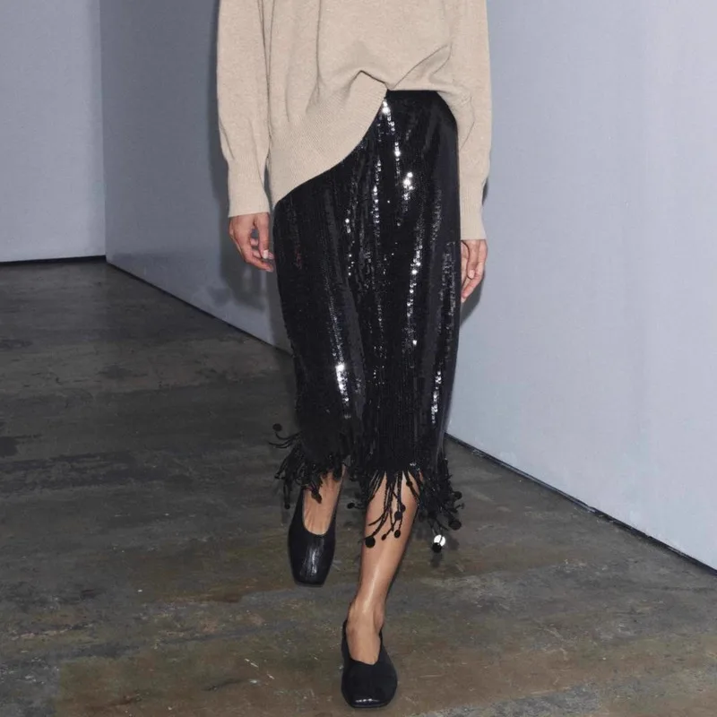 تنورة نسائية عصرية بشرابة ترتر للخريف والشتاء أنيقة من Demeanor بشرابة سوداء بقصة ضيقة عالية الخصر تنانير طويلة للتنقل اليومي