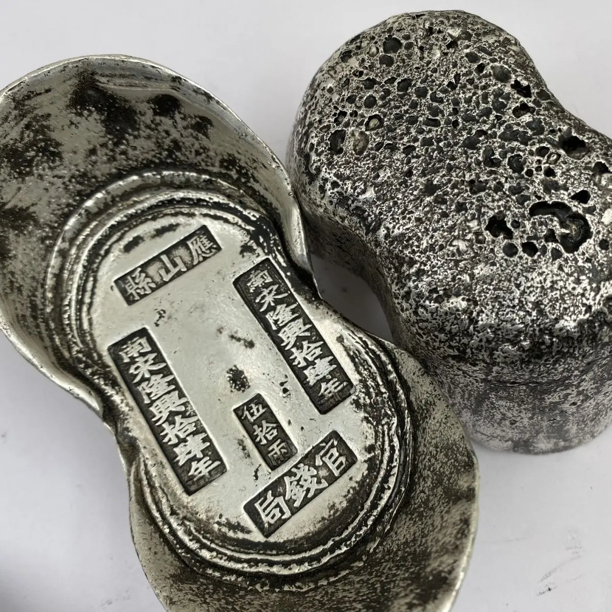 Fifty taels of antiques, Qing silver ingots, Qing Dynasty Qianlong Kangxi honeycomb, Yongzheng silver ingots, ingots, and five e