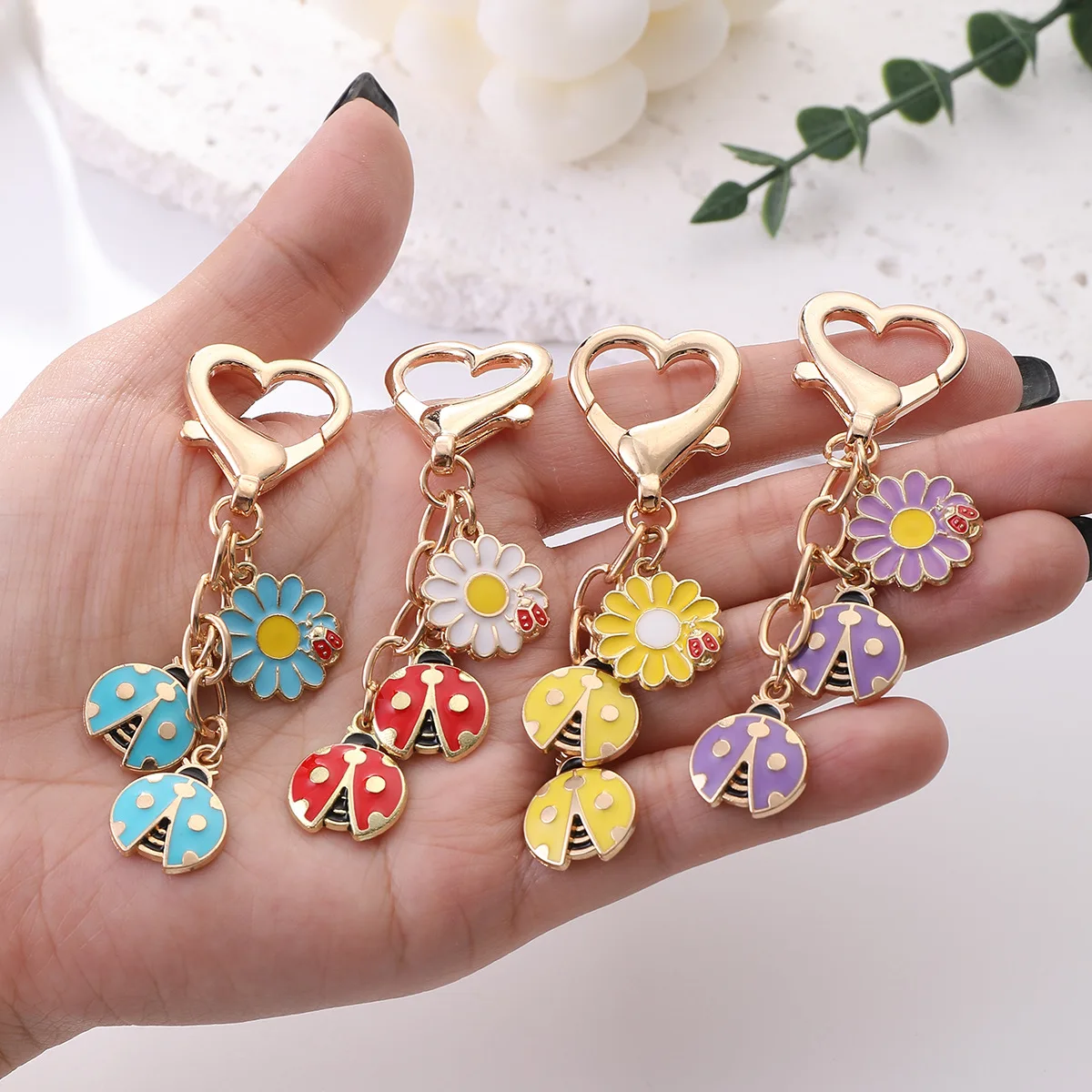 Cross border new ladybug keychain, alloy drip oil sunflower pendant, wholesale of girl's heart backpack accessories