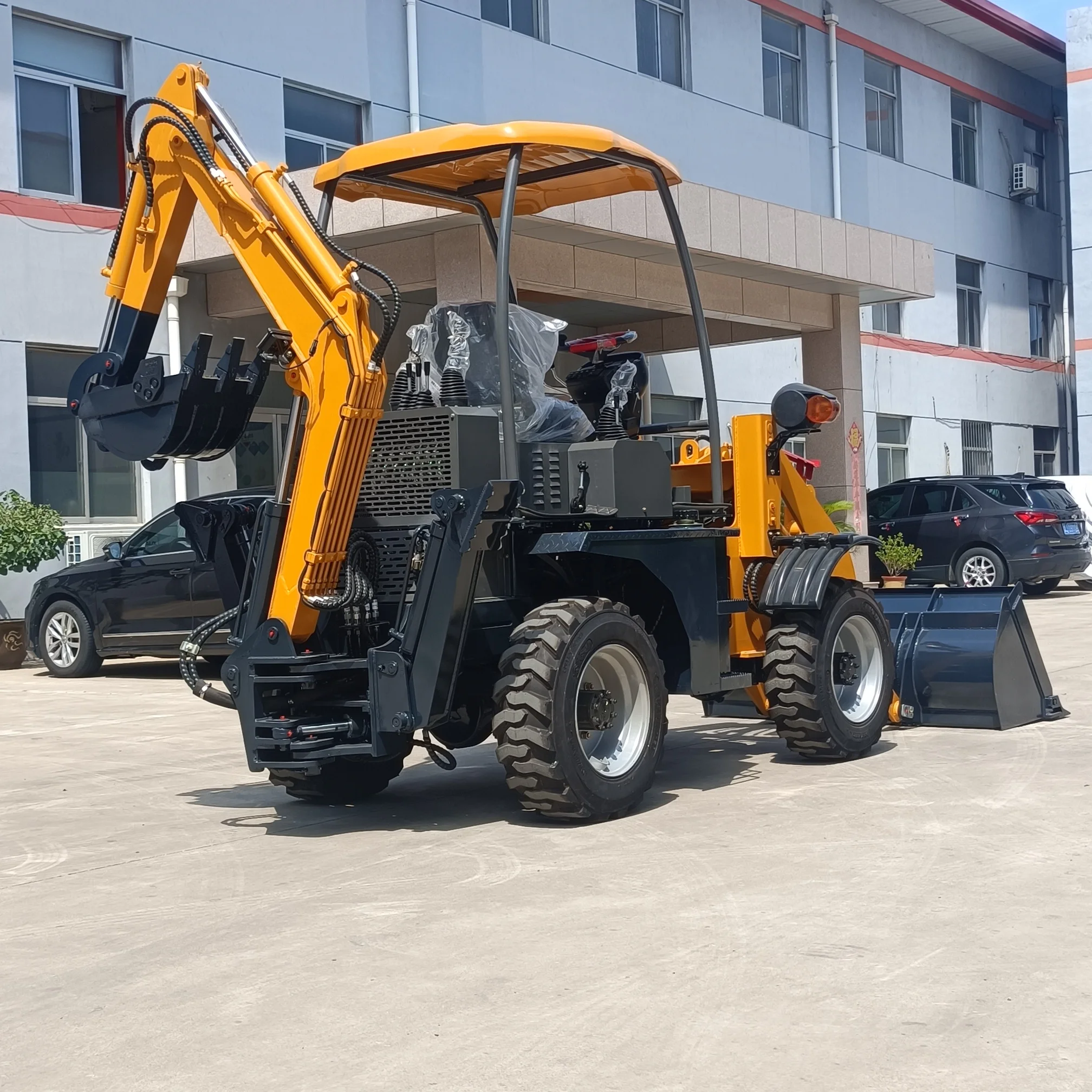 Four-Wheel Drive Mini Backhoe Loader Garden Construction Excavator with Various Attachments Wheel Loader's Core Components Motor