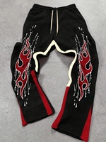 Men's Street Fashionable Slightly Flared Sweatpants with Striking Red Flame Prints Artfully Crafted from Polyester Fabric