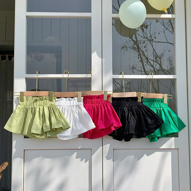 Meninas shorts 2024 novo verão estilo coreano babados hem calças de algodão meninas shorts cor sólida pétala calças crianças saia dividida