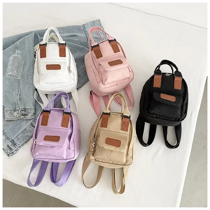 Mini Mochila pequeña coreana para mujer, bolso de lona para chica adolescente, bolso de hombro para teléfono, monedero femenino, nueva tendencia de moda