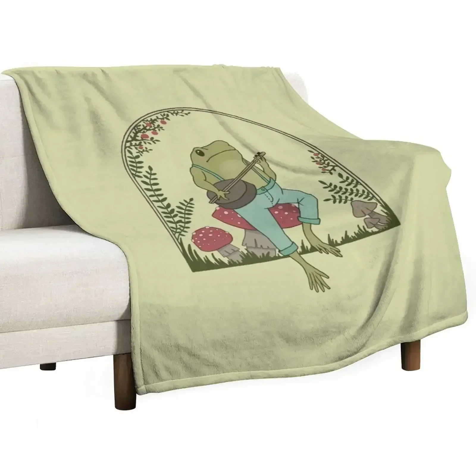 

Cottagecore Aesthetic Frog Playing Banjo on Mushroom Cute Vintage - Goblincore Farmer Toad in Garden - Dark Academ Throw Blanket