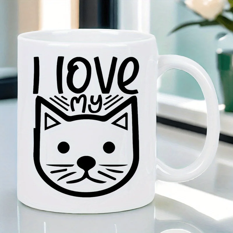 This adorable cat-themed mug features the words 