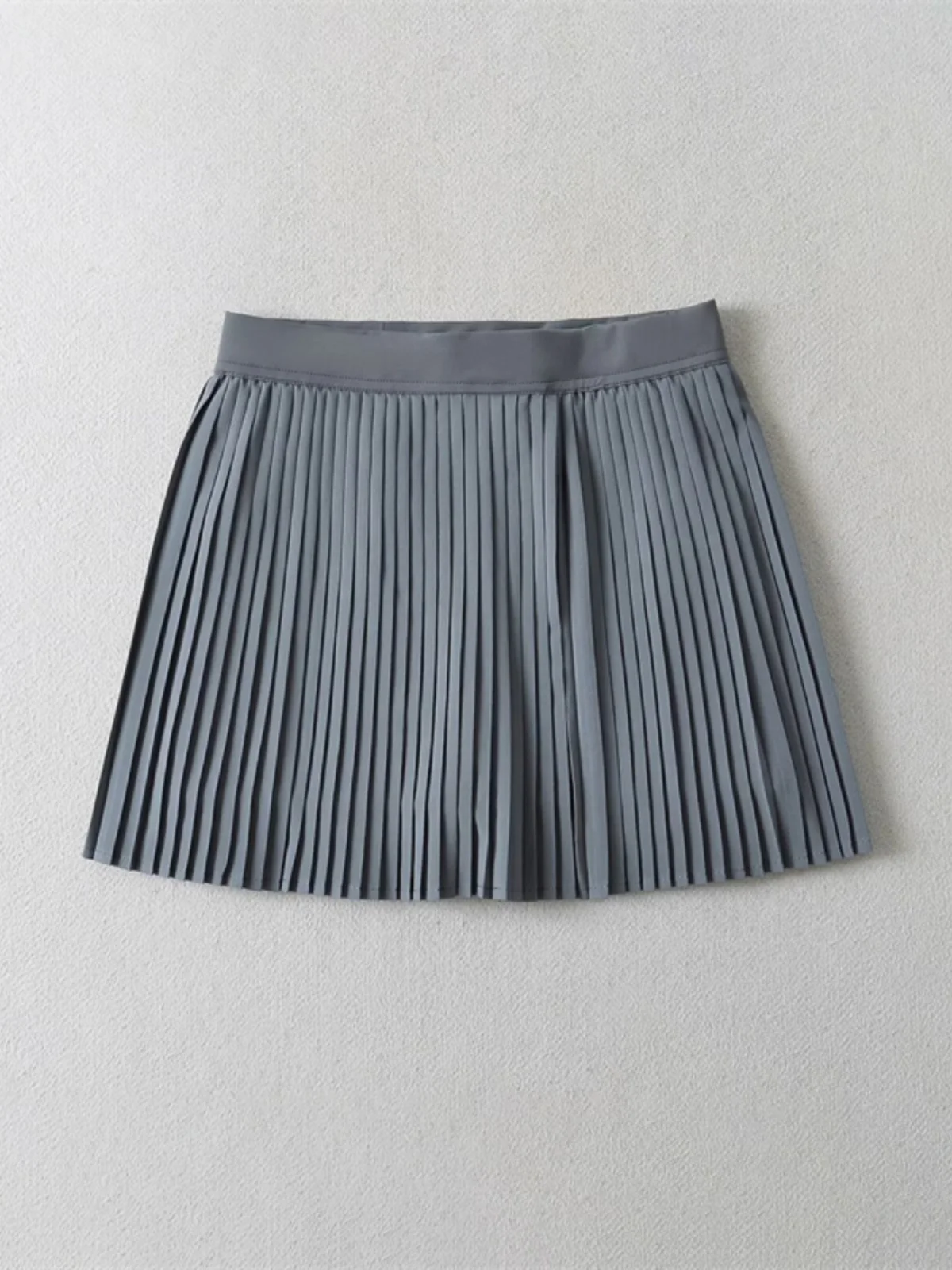 Zoete en pittige Street Sle-tennisrok met accordeonplooien Anti-lichte rok Elastische taille Afslankend ontwerp voor meisjes