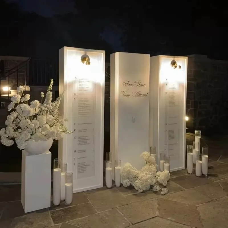 White acrylic wedding arch seating plan signage for weddings and guest greetings, complete with beautiful clock