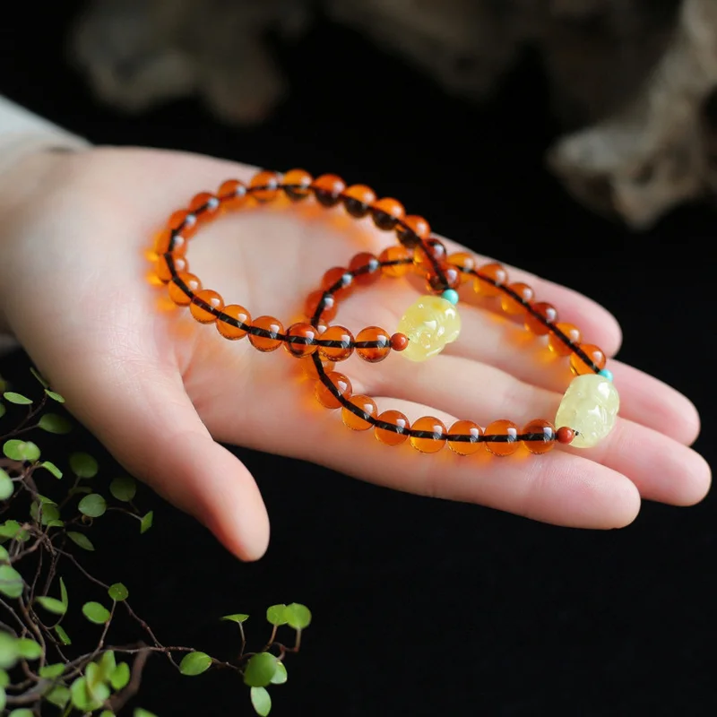 

Blood Round Bead Rich Wine Red With Amber Piggy Single Strand Bracelet