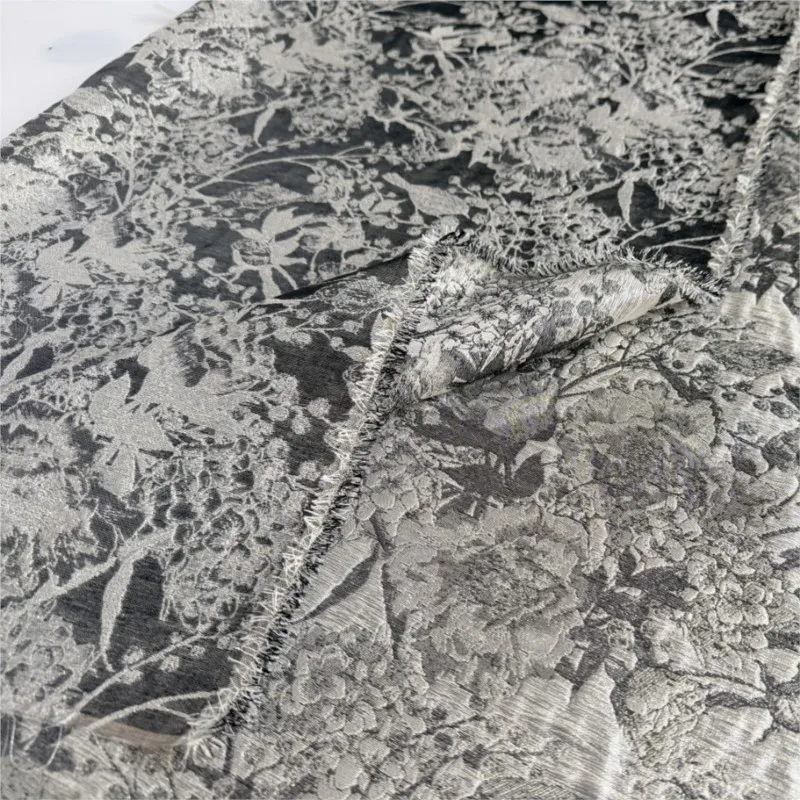 The fabric for women's evening gowns is a thin and slightly transparent acetate tencel jacquard made of seep yarn