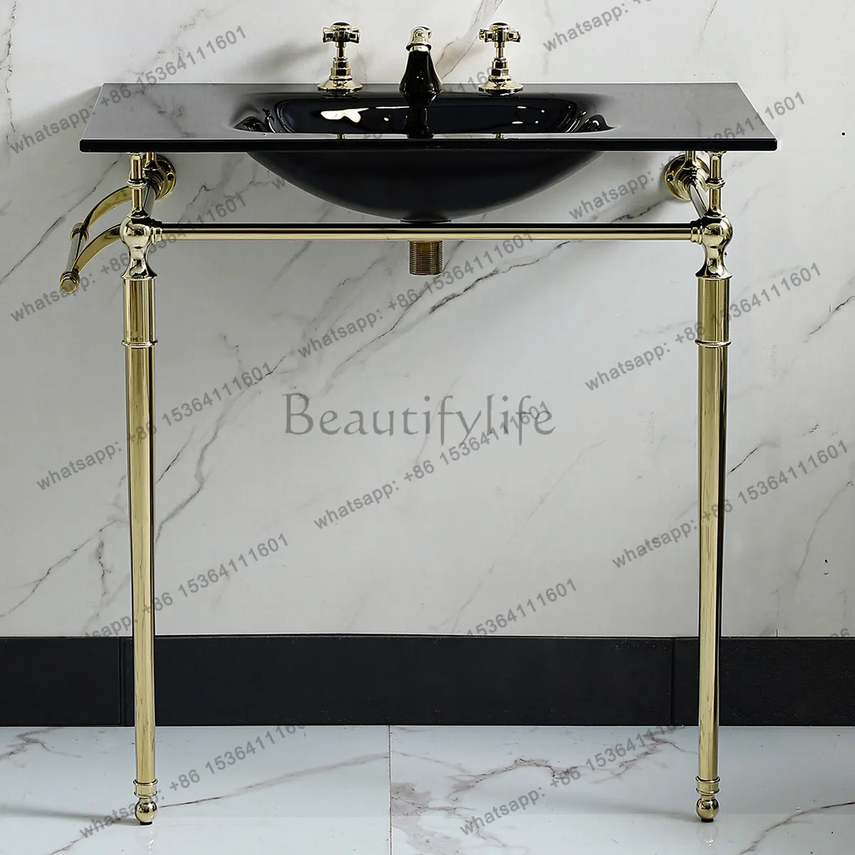 Black glass washbasin with gold copper metal bracket