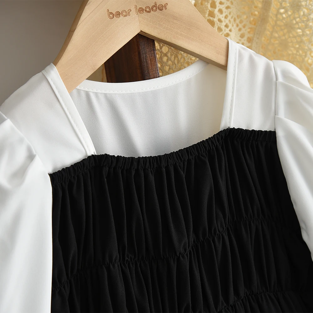 ชุดเดรสลำลองเด็กผู้หญิง สไตล์มินิมอล สีดำขาว สำหรับเด็กอายุ 3-7 ปี รุ่นใหม่ประจำฤดูใบไม้ร่วง ดีไซน์ตัดสี แต่งโบว์ แฟชั่นทันสมัย