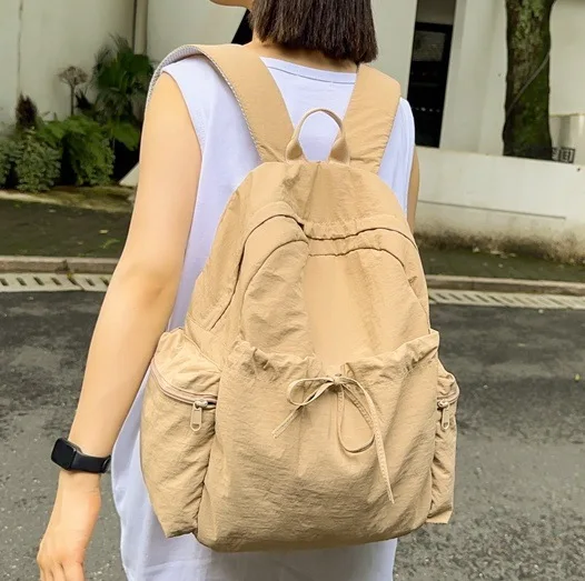 Korean Minimalist 2025 New Solid Color Large Capacity Lightweight Backpack Student School Bag Travel Dual Purpose Unisex Design