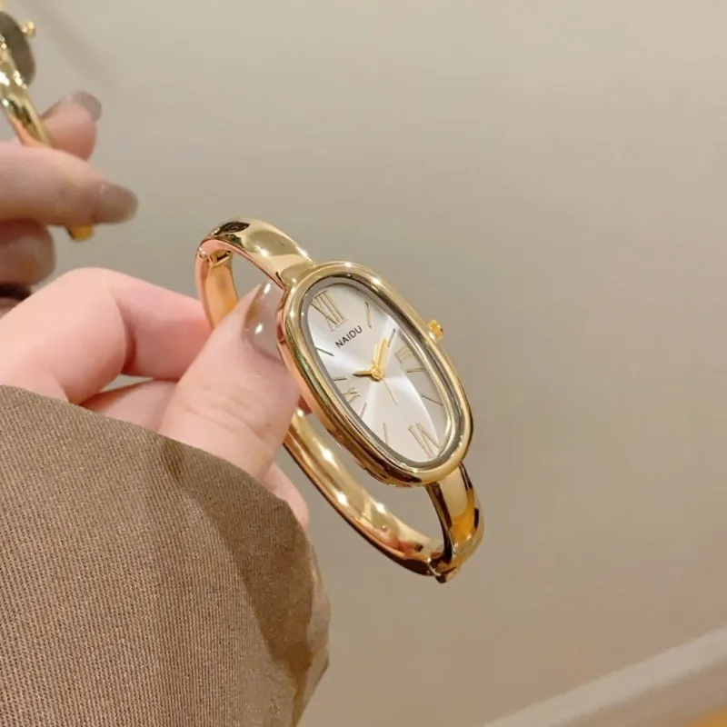 

Элитные женские кварцевые часы в римском стиле с простым золотым браслетом, овальным циферблатом, наручные часы для женщин, часы для платья, Montre Femme