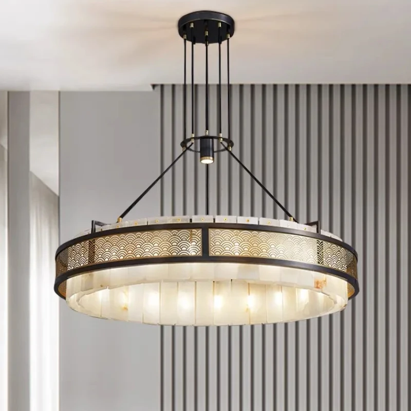 

Minimalist Marble Halo Chandelier This dimmable lamp is pure sculptural form. Its single ring of marble provides a soft lustre